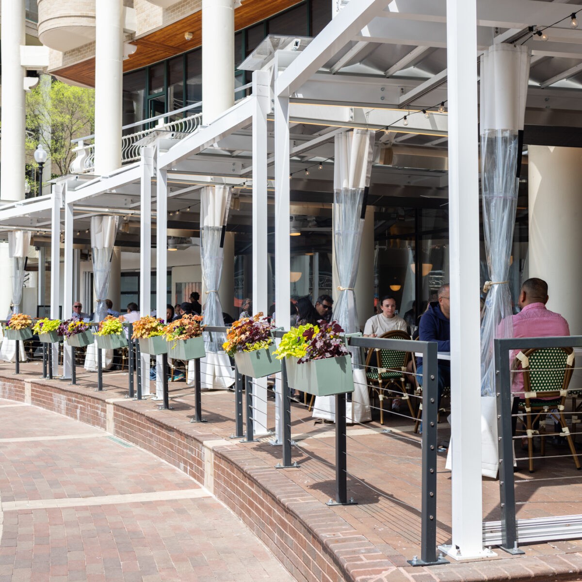 Guests dining in a warm, busy Founding Farmers dining room